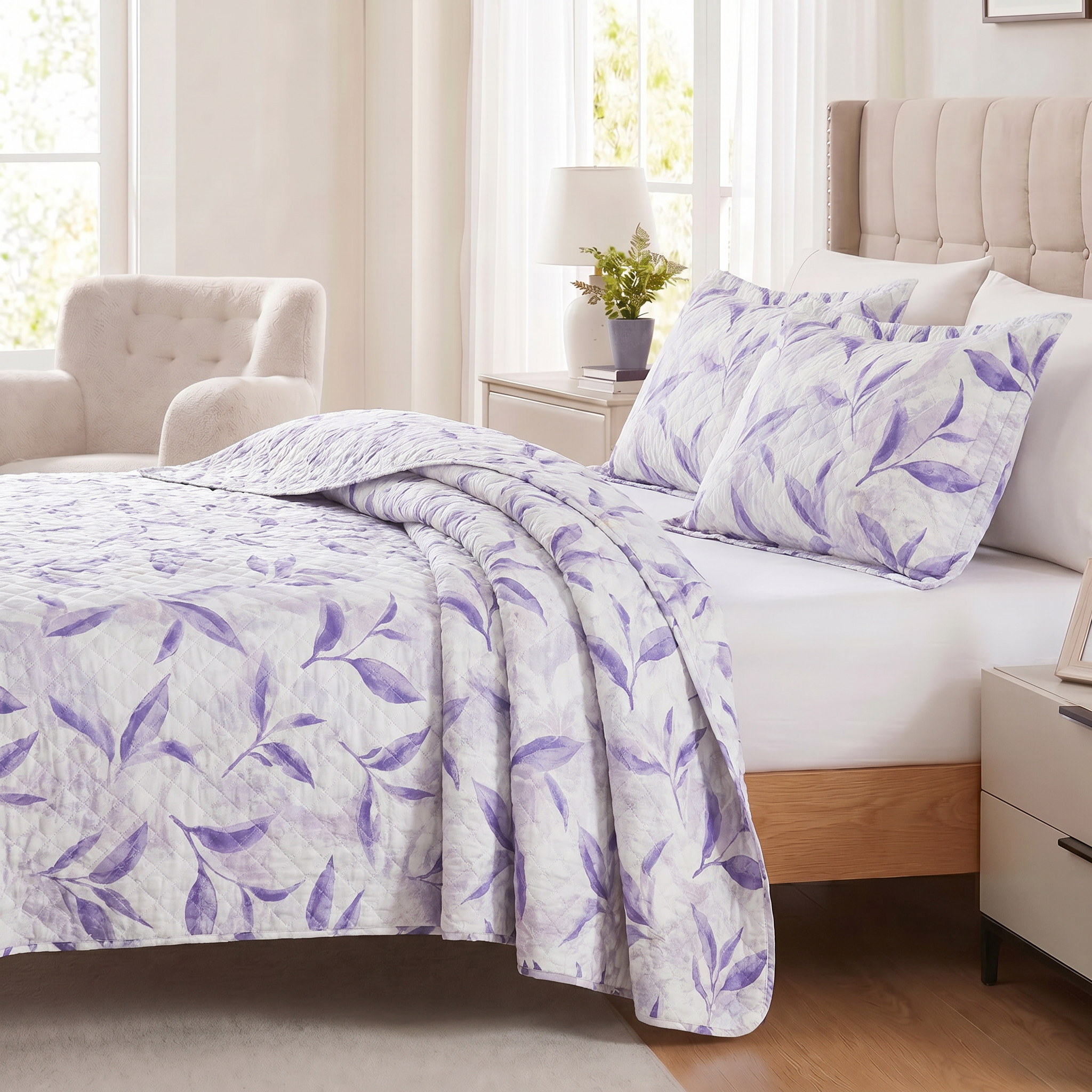 Bed with purple leaf patterned bedding in a bright bedroom