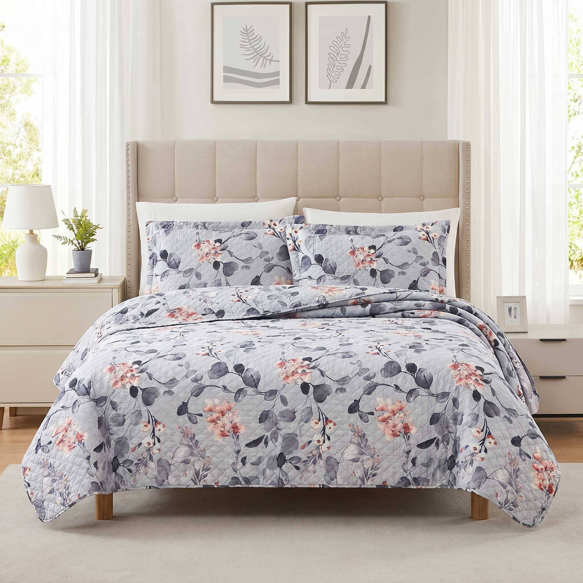 Floral patterned comforter set on a bed in a well-lit bedroom.