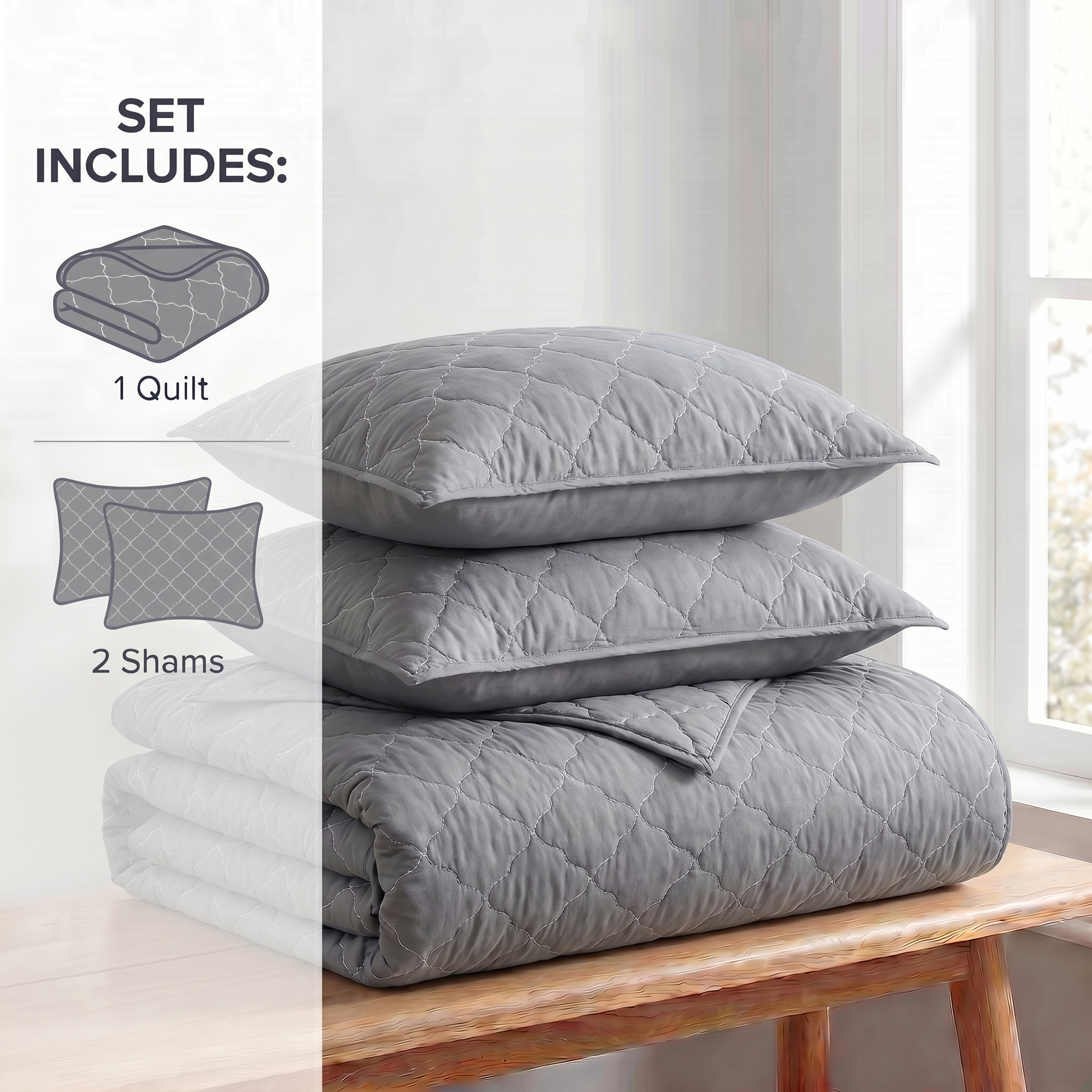 Gray quilt set with two shams and a quilt on a wooden bench.